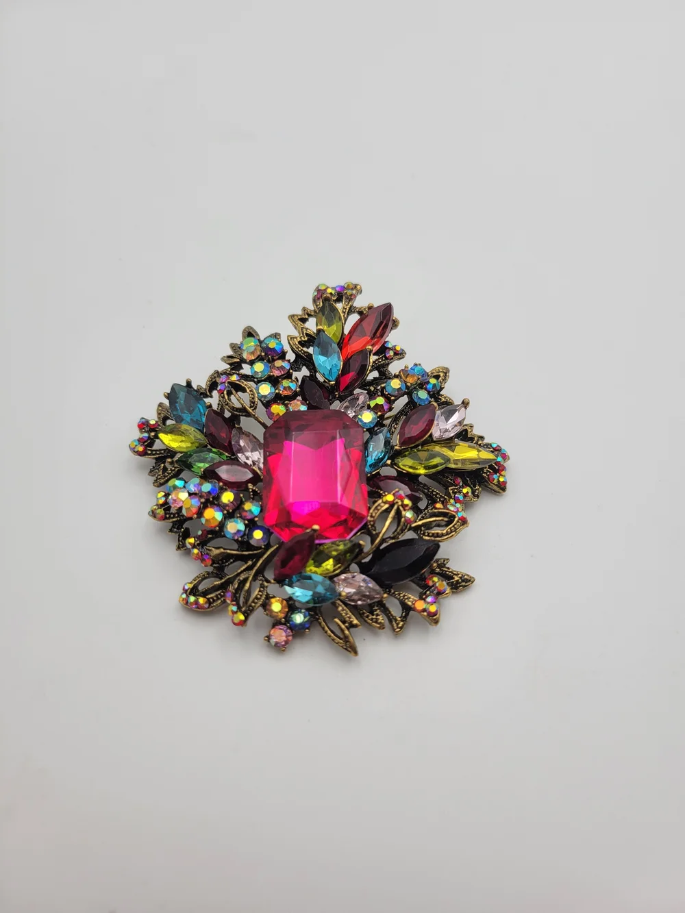 Vintage-Inspired Multicolor Crystal Brooch with Hot Pink Center